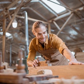 Handsome,Carpenter,Working,With,A,Wood,,Looking,On,The,Bar, Handsome,Carpenter,Working,With,A,Wood,,Looking,On,The,Bar,